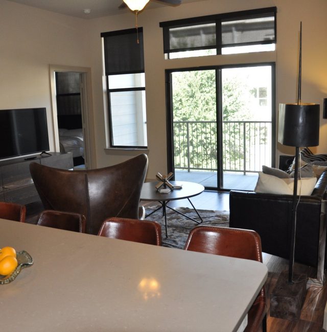 Kitchen view of living room from the Texas design at Premier Patient Housing.