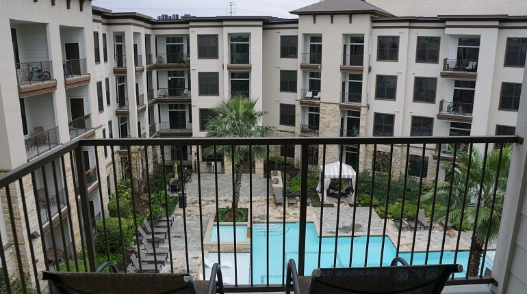Balcony and pool view from the Florida Design at Premier Patient Housing.