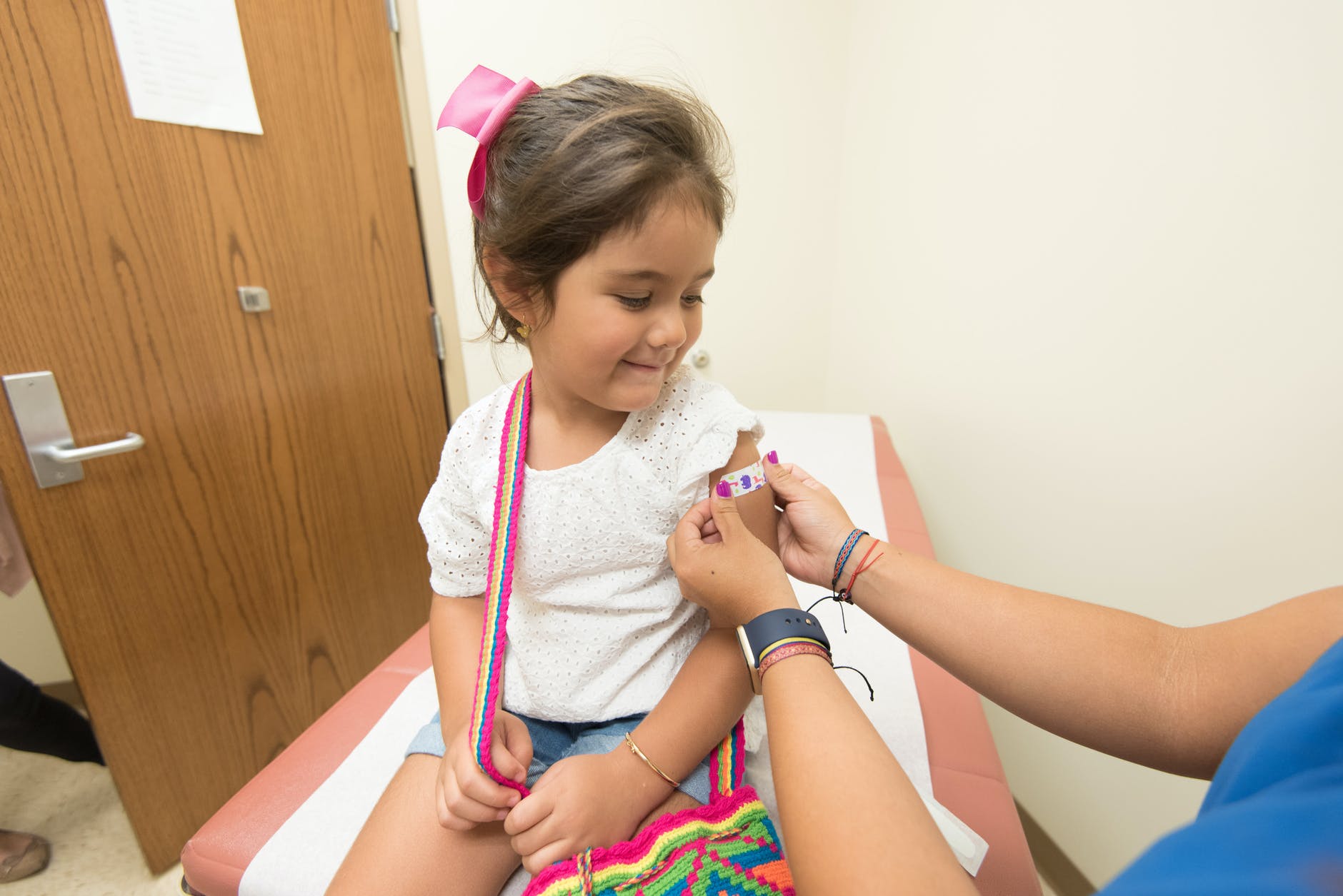 young girl receiving a vaccine 