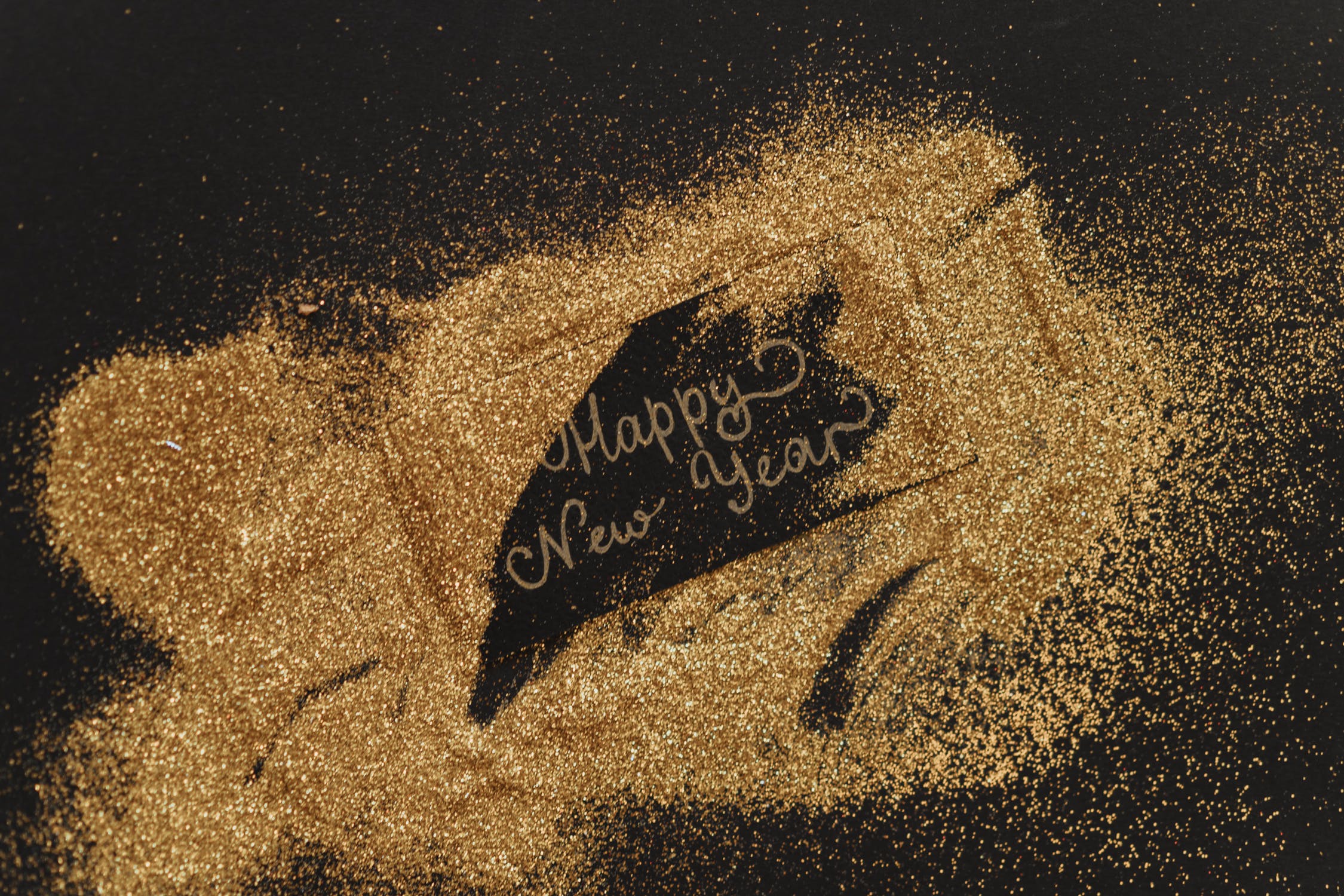 happy new year written with glitter