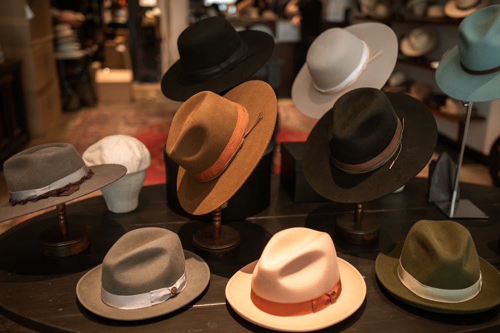 cowboy hats on display in rodeo shop 