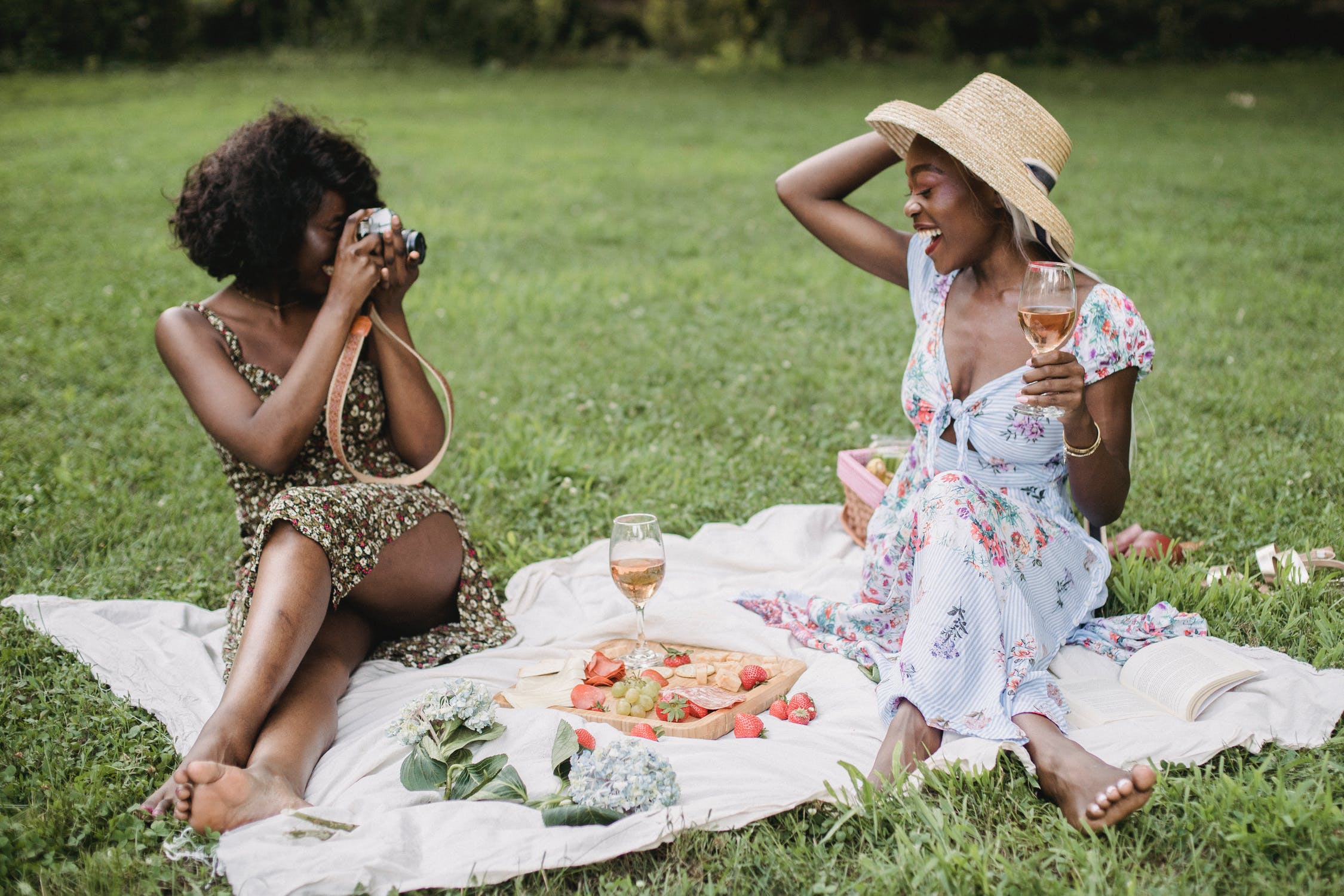 women taking pictures at picnic