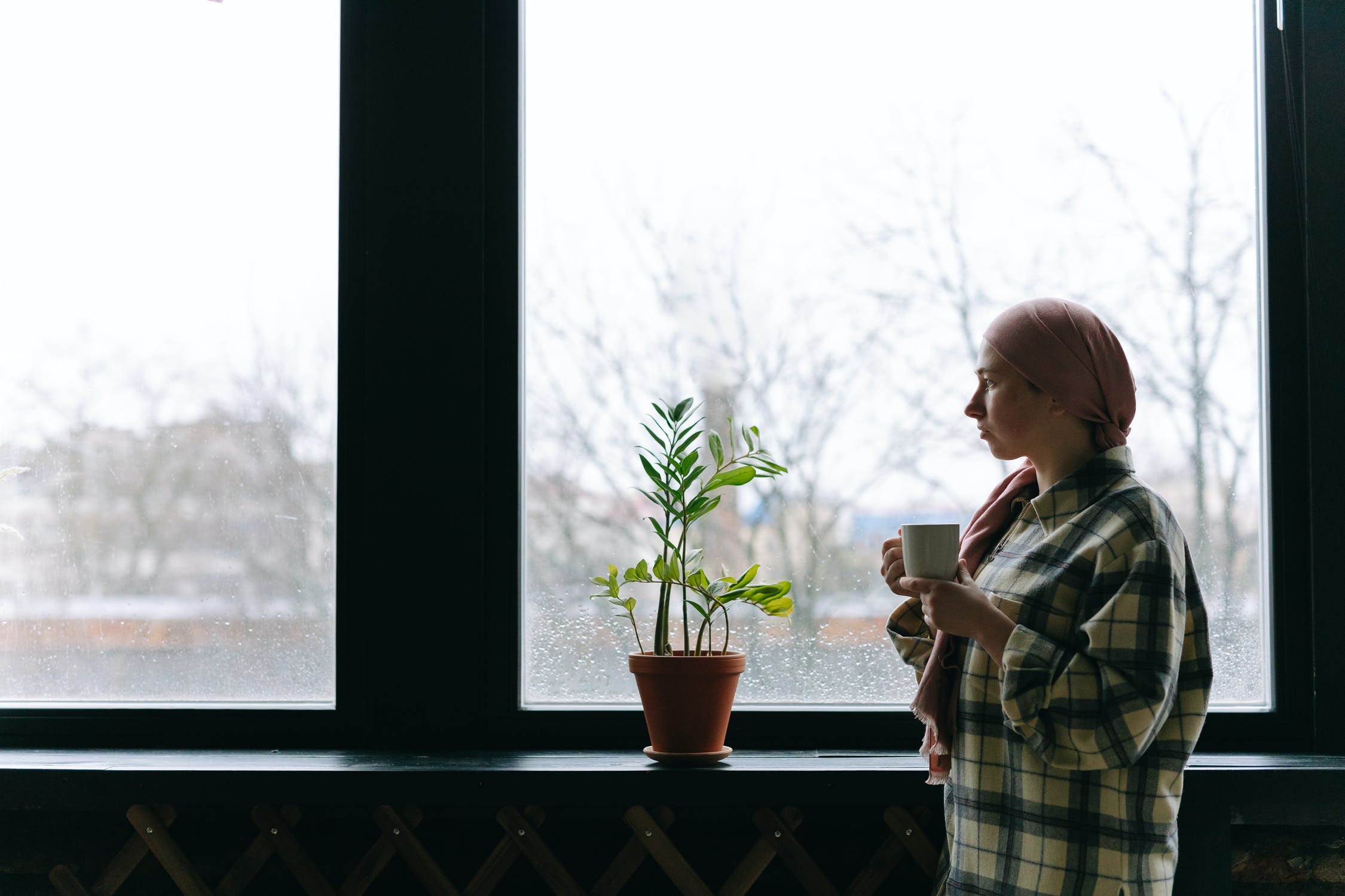 woman looking out of window