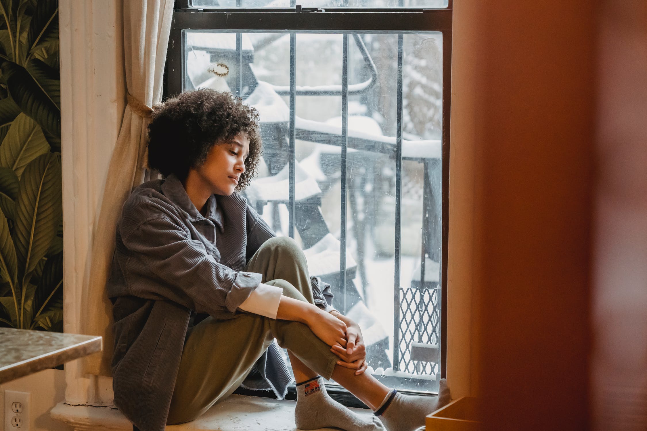 sad woman in window