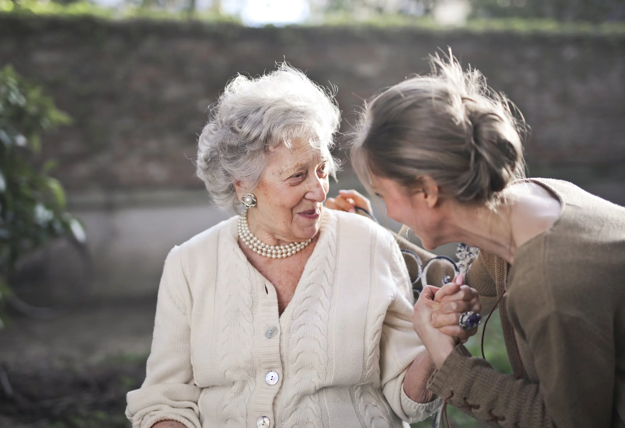 young woman with older woman with Alzheimer's