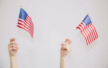 hands holding American flags