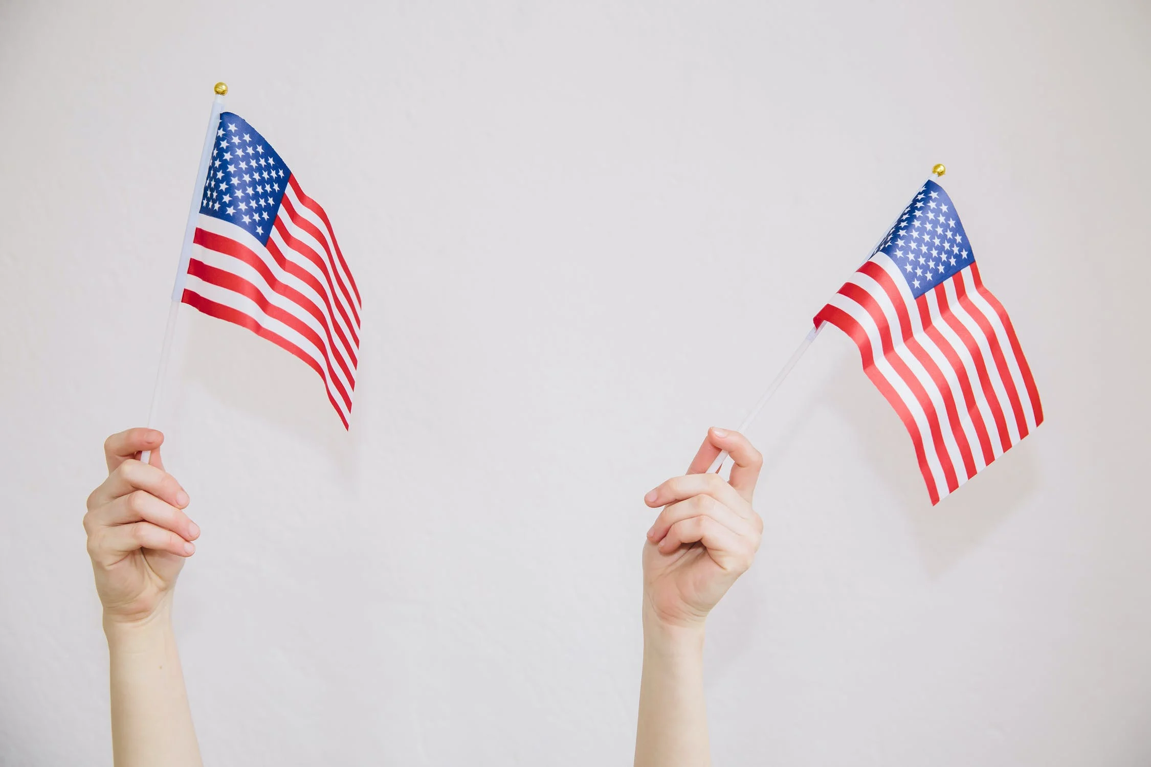 hands holding American flags