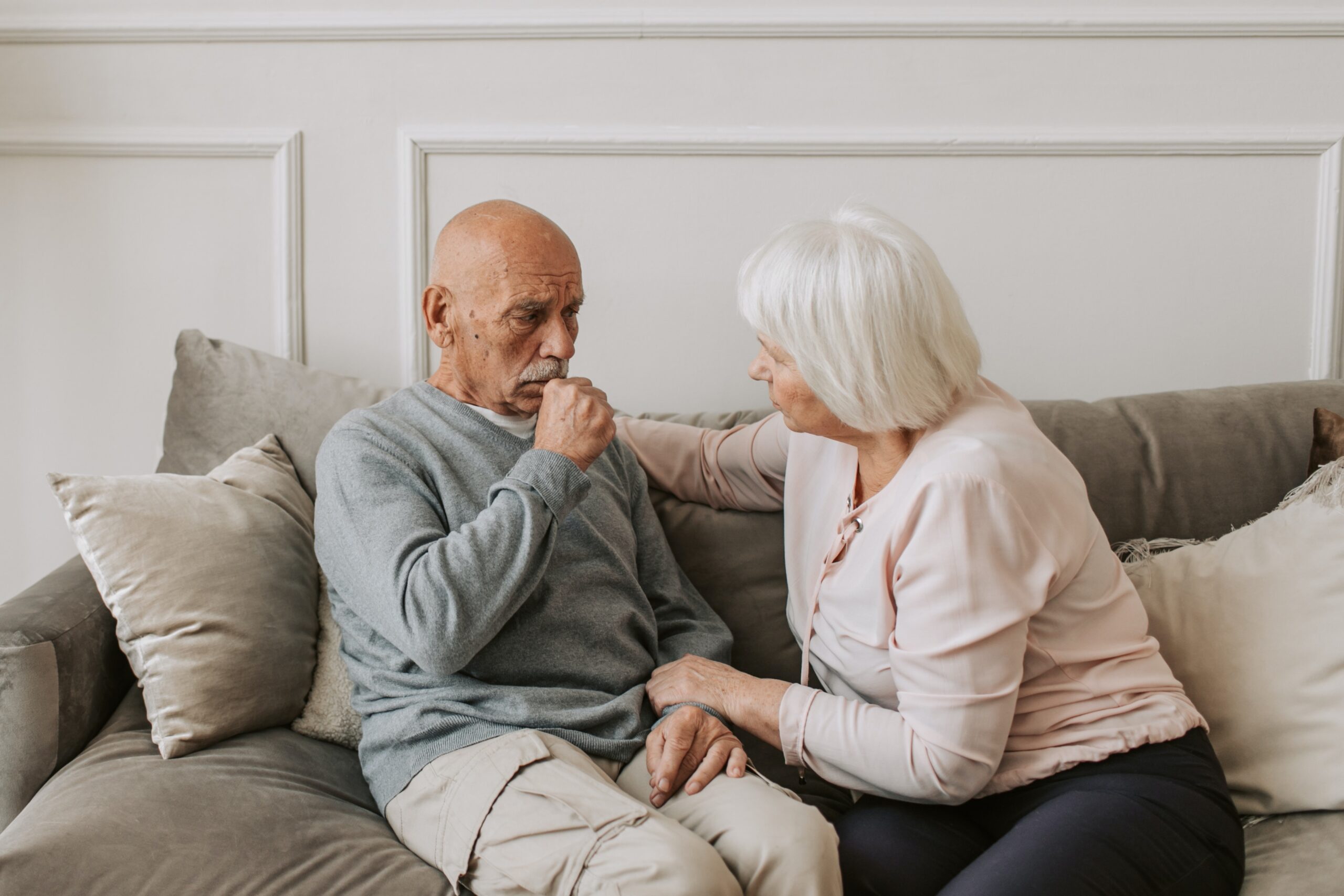 sick patient man coughing with woman